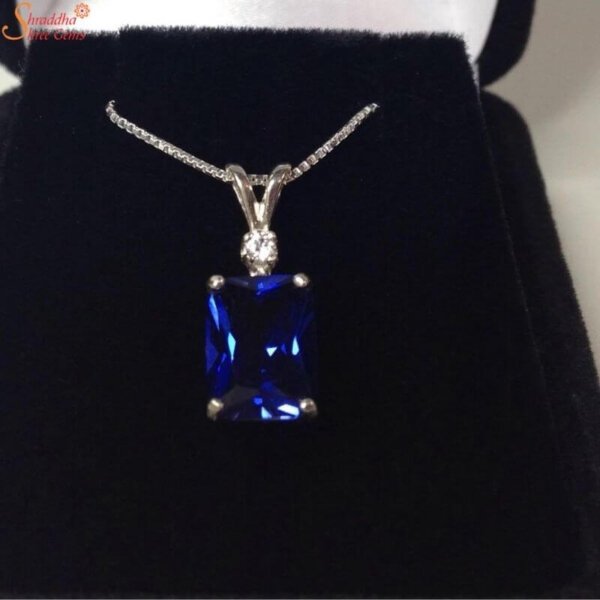 emerald shape blue sapphire pendant with moissanite