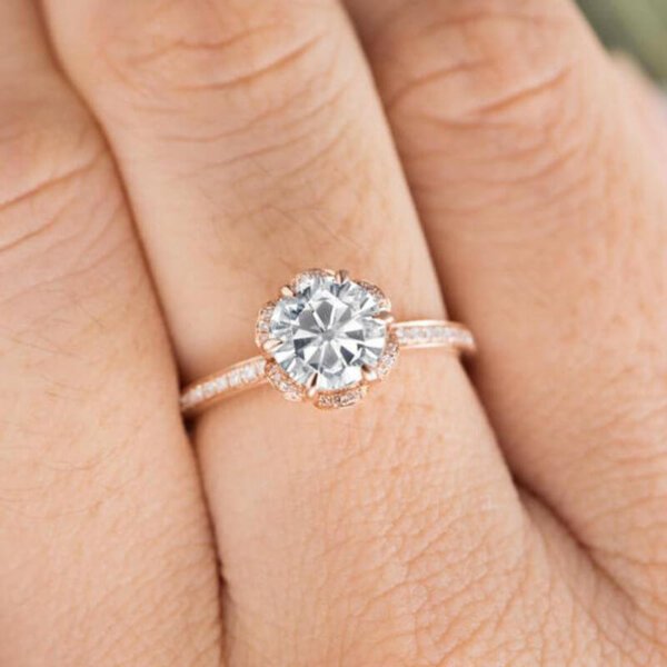 Free Photo | Woman hand with flower-shaped diamond ring with white and  burgundy stone