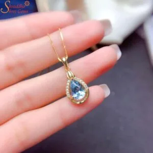 blue topaz pendant with moissanite diamond