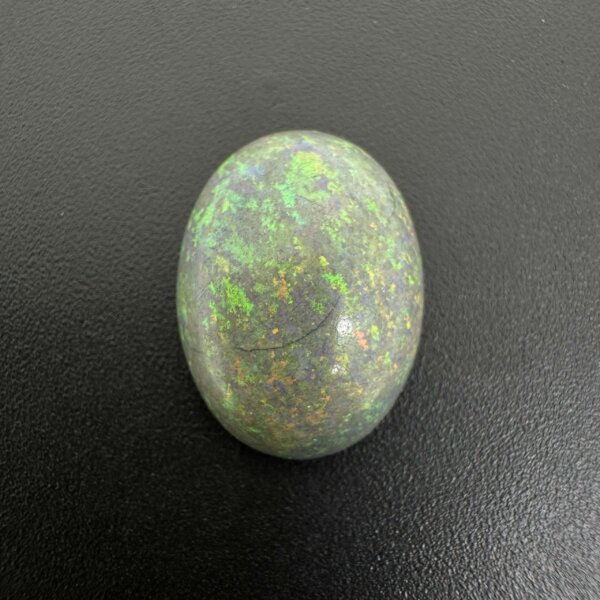 Natural Australian black opal gemstone 6.35 carat with rare color play and premium dark body tone