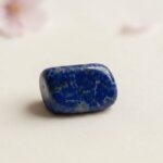 Natural lapis lazuli tumble stone polished blue crystal shown in front side top and angled views