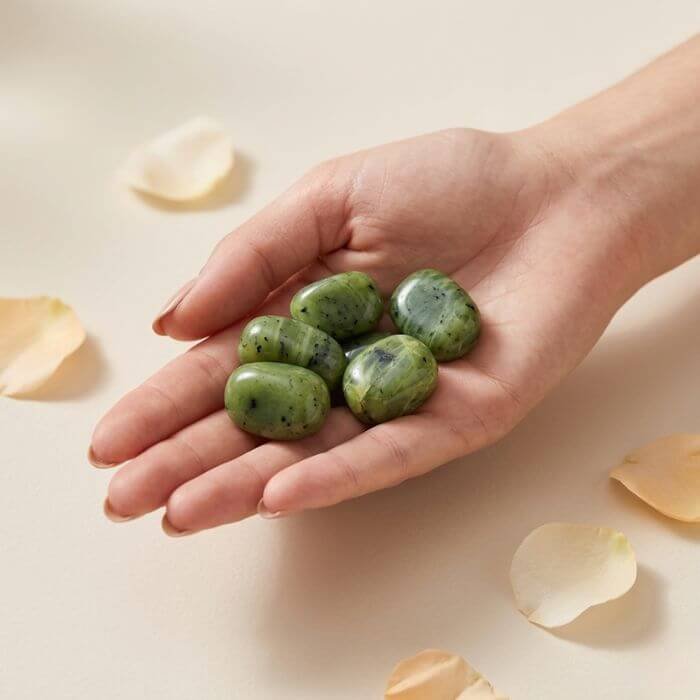 2 Natural green jade tumble stone polished green crystal shown in front side top and angled views