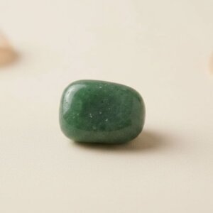 Natural green aventurine tumble stone polished green crystal shown in front side top and angled views
