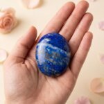 Natural lapis lazuli crystal palm stone polished deep blue stone with golden flecks shown in front, side, top and angled views