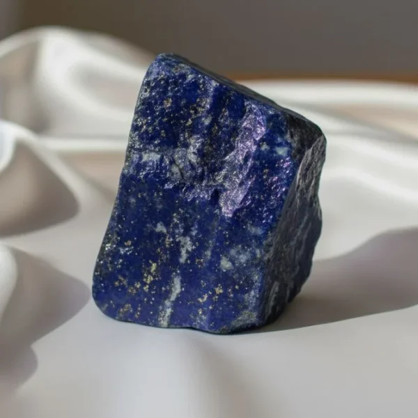 Lapis Lazuli Crystal featuring a deep blue natural stone with golden flecks and a rich texture.