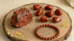 Red Jasper Combo Set featuring a red jasper bracelet, raw stones, and polished tumbles in one collection.