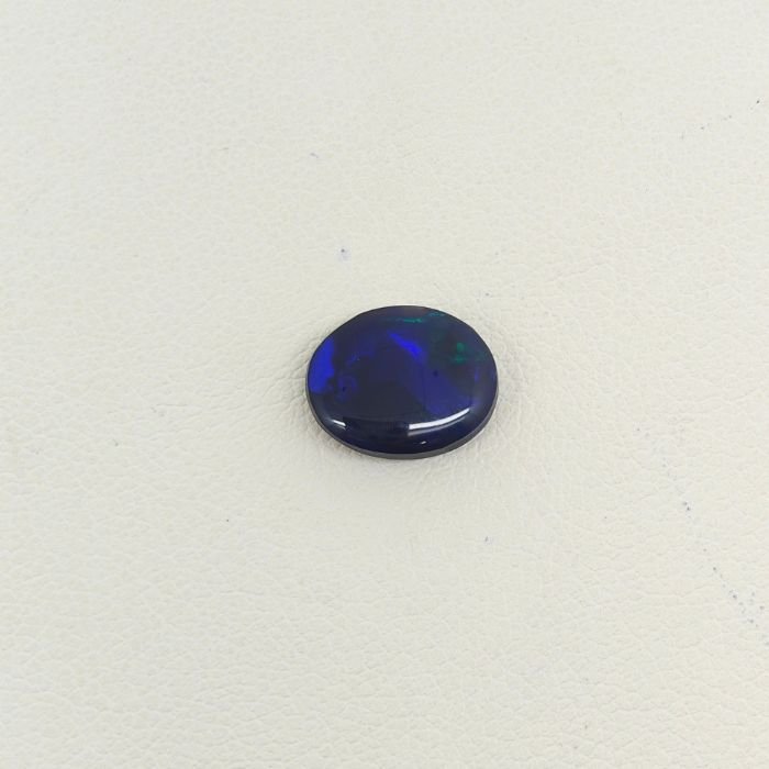 Black Opal BOP-001 Buy Natural Black Opal Gemstone featuring mesmerizing multicolor play-of-color, deep dark body tone, and exceptional natural brilliance.