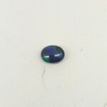 Natural Black Opal gemstone featuring mesmerizing multicolor flashes, deep dark body tone, and exceptional natural brilliance.