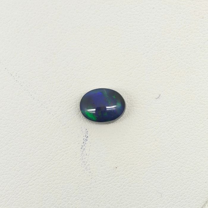 Black Opal BOP-002 Natural Black Opal gemstone featuring mesmerizing multicolor flashes, deep dark body tone, and exceptional natural brilliance.