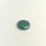Natural Black Opal gemstone featuring vivid multicolor play-of-color, deep dark body tone, and exceptional natural brilliance.