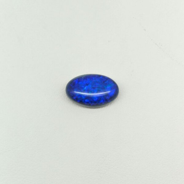 Natural Black Opal gemstone featuring vivid multicolor play-of-color, deep dark body tone, and exceptional natural brilliance.