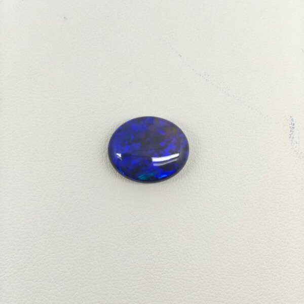Black Opal BOP-009 featuring vibrant multicolor flashes, deep dark body tone, and exceptional natural brilliance.