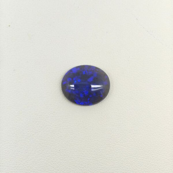 Black Opal BOP-012 featuring vibrant multicolor flashes, deep dark body tone, and exceptional natural brilliance.