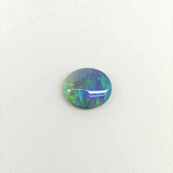 Natural Black Opal BOP-014 displaying intense rainbow flashes across a deep dark body tone with exceptional natural brilliance and rarity.