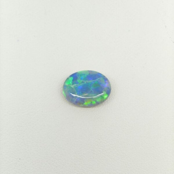 lack Opal BOP-016 featuring vibrant rainbow flashes, deep black body tone, and exceptional natural gemstone brilliance.