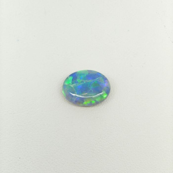 Black Opal BOP-016 lack Opal BOP-016 featuring vibrant rainbow flashes, deep black body tone, and exceptional natural gemstone brilliance.