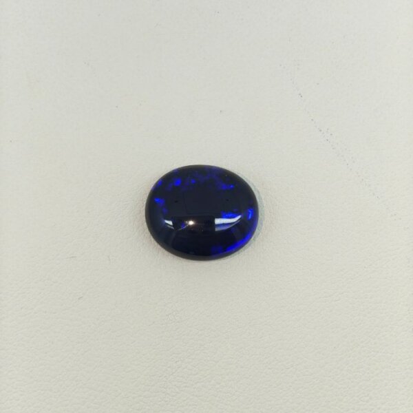 Black Opal BOP-017 featuring dazzling rainbow flashes, deep black body color, and exceptional natural gemstone brilliance.