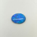 Black Opal BOP-019 featuring spectacular rainbow flashes, deep black body color, and exceptional natural gemstone brilliance.