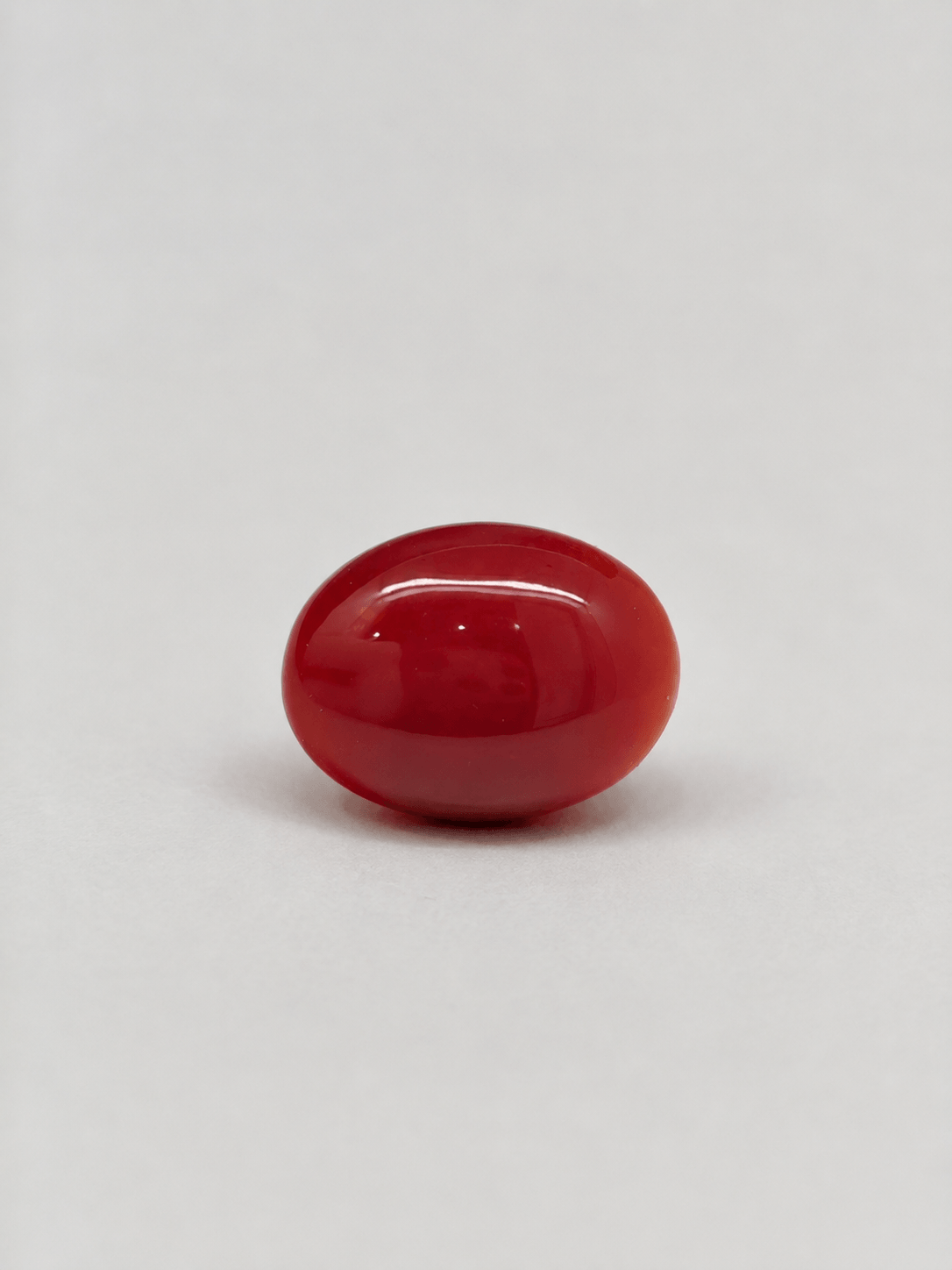 Natural Japanese Coral red to orange oval gemstone JCR-013 from Japan