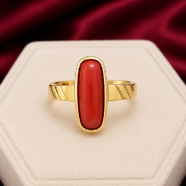 Coral Ring featuring a vibrant red coral gemstone set in an elegant polished ring design with timeless natural beauty.