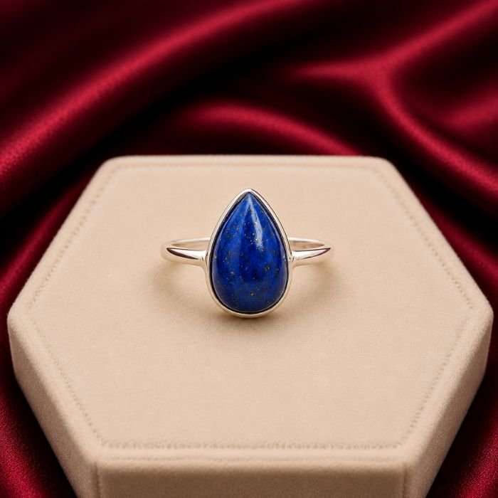 Lapis Lazuli Ring featuring a deep royal blue lapis lazuli gemstone with natural golden flecks set in an elegant ring design.
