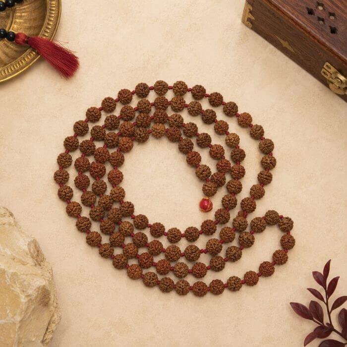 Rudraksha Mala featuring natural Rudraksha beads strung together in a traditional spiritual prayer necklace design.