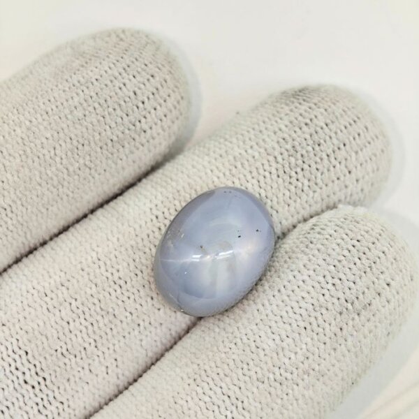 Certified Natural Star Blue Sapphire gemstone with a beautiful natural asterism, rich blue color, and smooth oval cabochon shape, ideal for jewelry and gemstone collections.