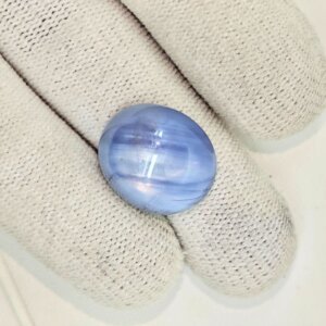 Premium Natural Star Blue Sapphire gemstone featuring a captivating star effect (asterism), rich blue color, oval cabochon cut, and authenticity certification. Ideal for jewelry, collections, and astrology purposes.