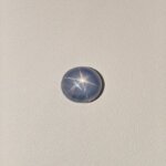 Star Blue Sapphire gemstone featuring a deep blue hue with a natural star-like asterism effect and radiant polished finish.