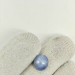 A stunning Star Blue Sapphire gemstone showcasing rich velvety blue tones, a captivating star-shaped light reflection, and refined natural brilliance admired for its rarity and astrological significance.
