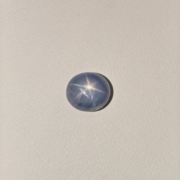 STAR BLUE SAPPHIRE ST-009 Star Blue Sapphire gemstone featuring a deep blue hue with a natural star-like asterism effect and radiant polished finish.