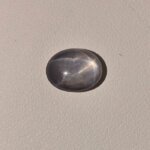 Star Blue Sapphire ST-010 featuring a deep blue natural gemstone with a prominent star-like asterism effect and polished radiant finish.