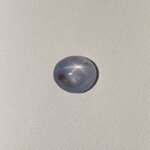 Star Blue Sapphire ST-012 featuring a rich deep blue natural gemstone with a striking star-like asterism effect and polished radiant finish.