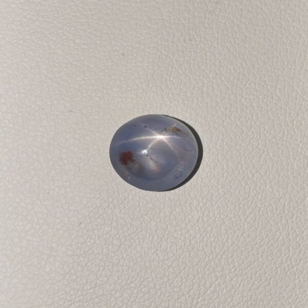 STAR BLUE SAPPHIRE ST-012 Star Blue Sapphire ST-012 featuring a rich deep blue natural gemstone with a striking star-like asterism effect and polished radiant finish.