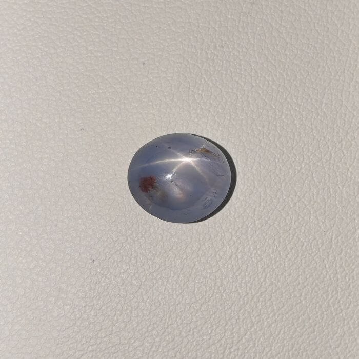 Star Blue Sapphire ST-012 featuring a rich deep blue natural gemstone with a striking star-like asterism effect and polished radiant finish.