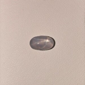 Star Blue Sapphire ST-013 featuring a deep royal blue natural gemstone with a luminous star-like asterism effect and polished elegant finish.