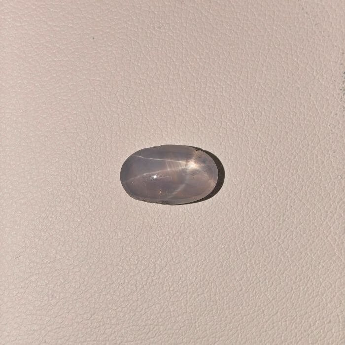 Star Blue Sapphire ST-013 featuring a deep royal blue natural gemstone with a luminous star-like asterism effect and polished elegant finish.