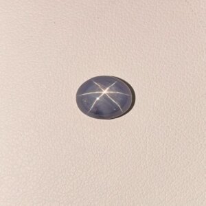 Star Blue Sapphire ST-014 featuring a rich royal blue natural gemstone with a brilliant star-like asterism effect and polished luxurious finish.