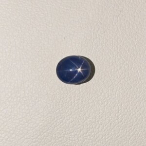 Star Blue Sapphire ST-018 featuring a rich deep blue natural gemstone with a radiant star-like asterism effect and polished premium finish.