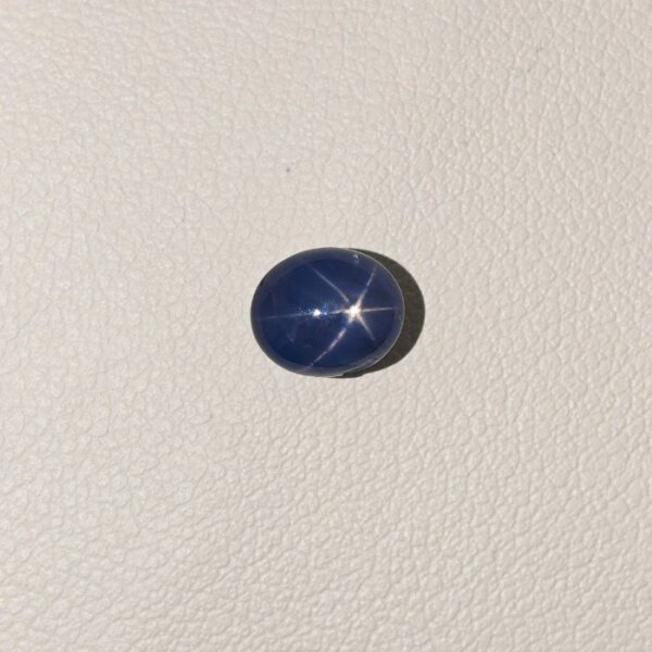 Star Blue Sapphire ST-018 featuring a rich deep blue natural gemstone with a radiant star-like asterism effect and polished premium finish.