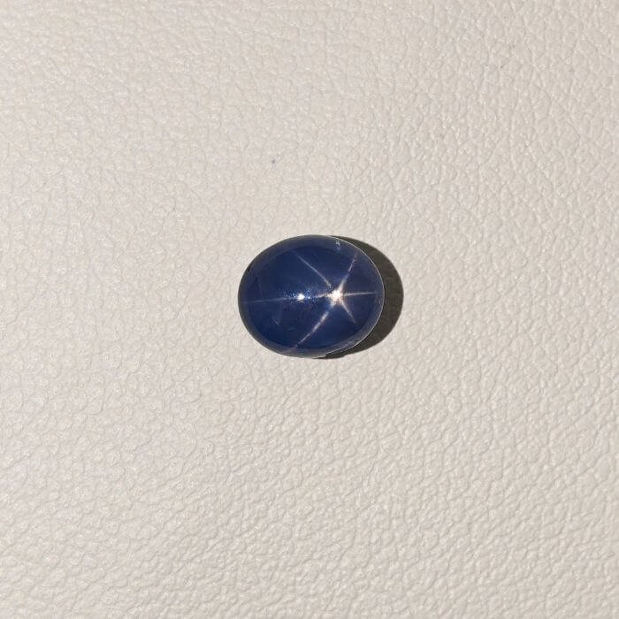 Star Blue Sapphire ST-018 featuring a rich deep blue natural gemstone with a radiant star-like asterism effect and polished premium finish.