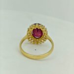 Back view of ruby and CVD diamond halo ring in yellow gold