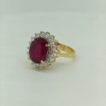 Ruby ring with CVD diamonds in yellow gold angled front view