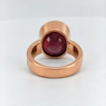 Back view of Vintage Oval Ruby Bezel Ring showing gemstone setting and wide ring band